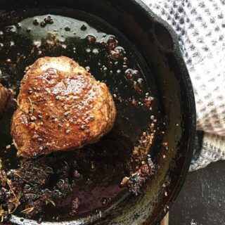 cooked steak in a cast iron skillet