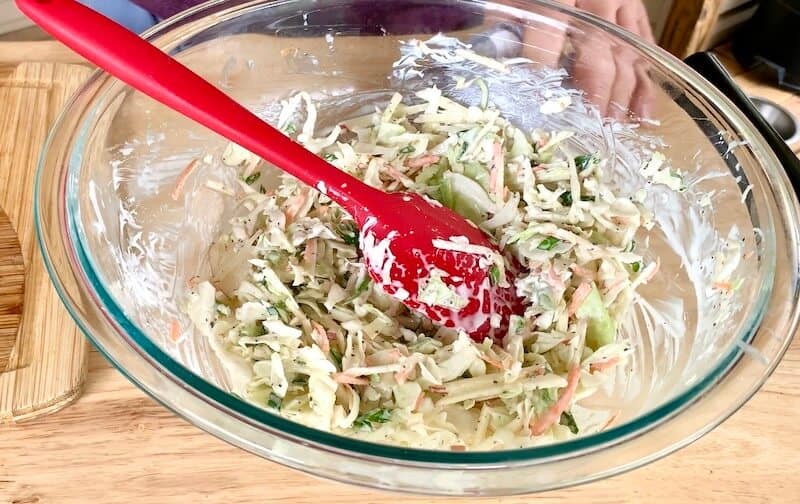 homemade coleslaw in a glass bowl