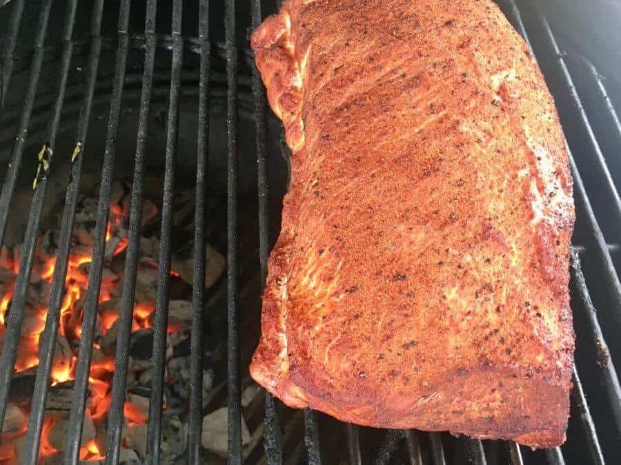 smoked pork loin on a charcoal grill