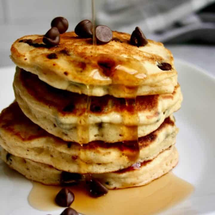chocolate chip muffin mix pancakes stacked up on a plate