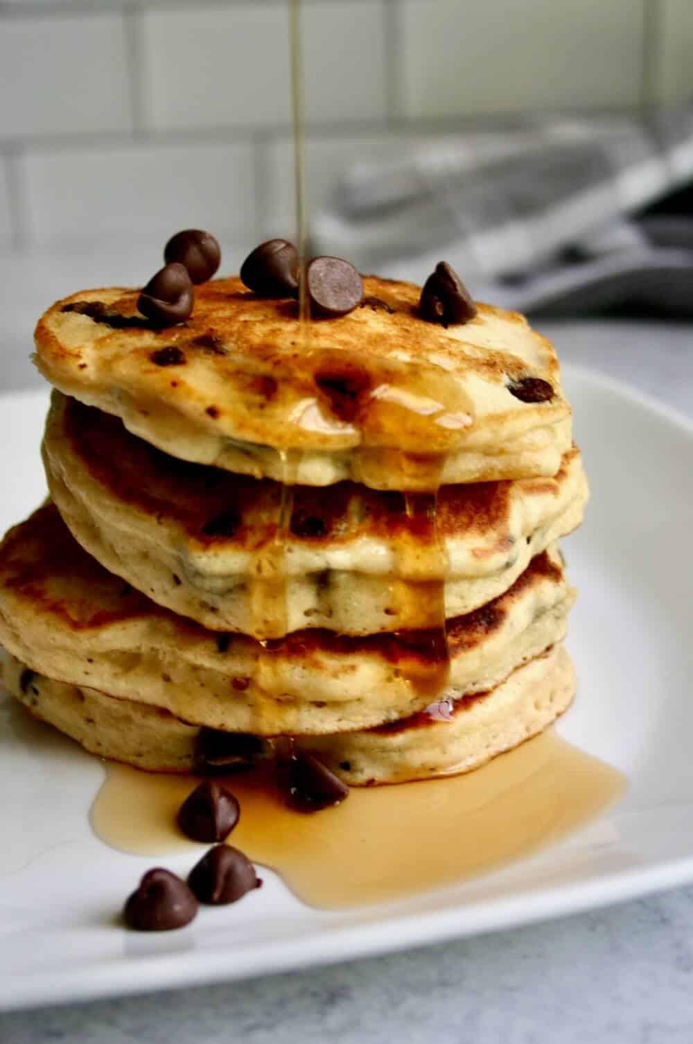 chocolate chip muffin mix pancakes stacked up on a plate