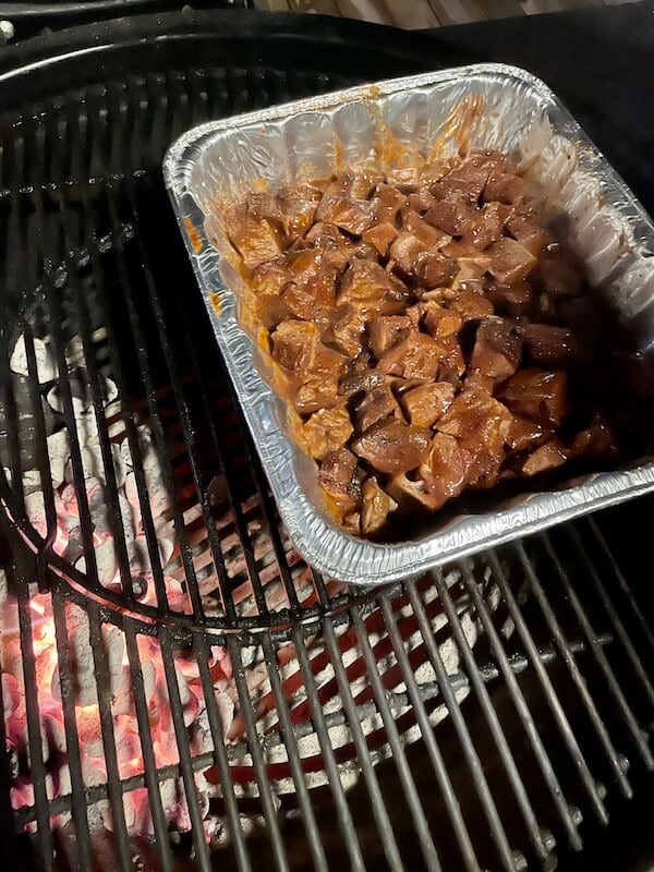 Poor Man's burnt ends in a foil pan on the grill