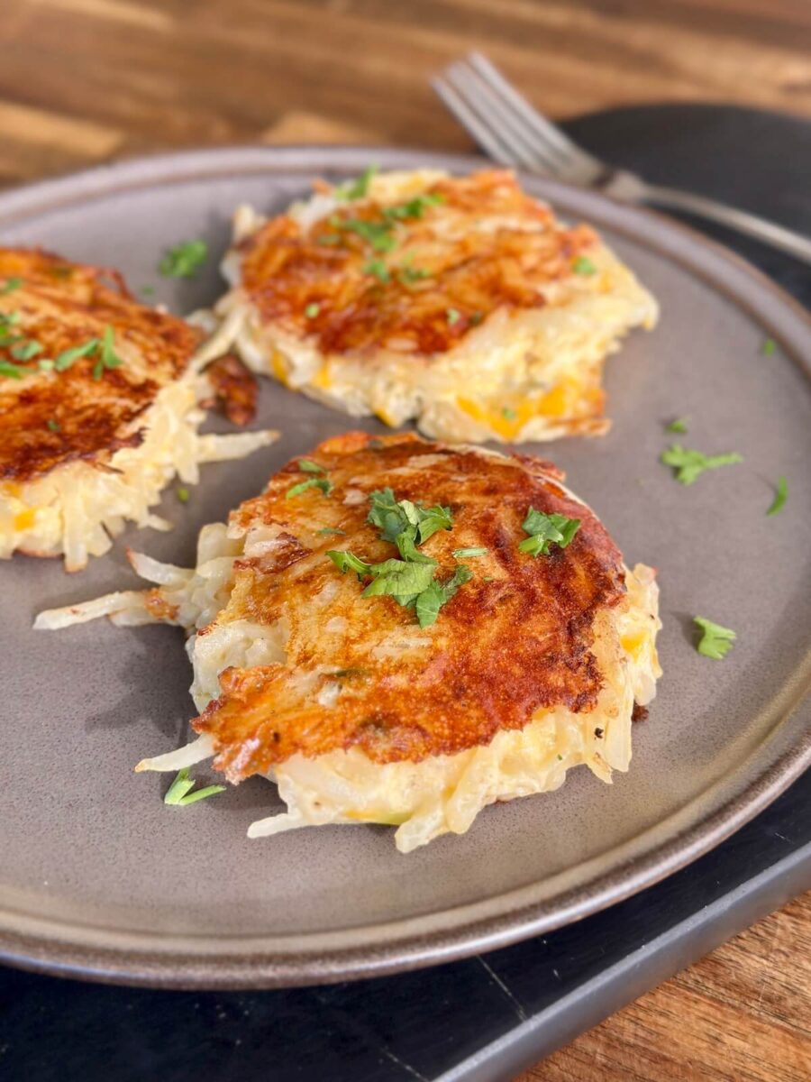 3 hash brown casserole cakes on a plate