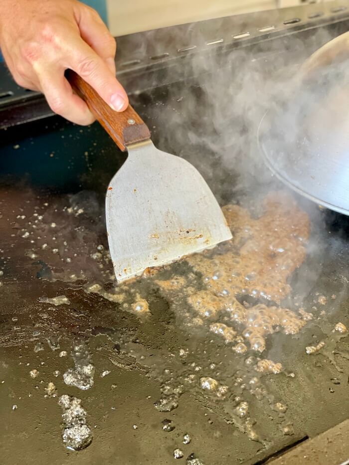 using water to create steam and clean a Blackstone griddle