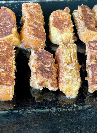cinnamon toast crunch french toast sticks cooking on a griddle