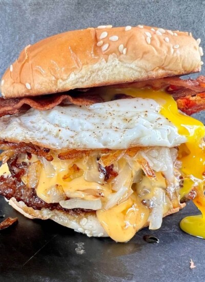 breakfast burger with egg, bacon, cheese, hash browns, and burger patty