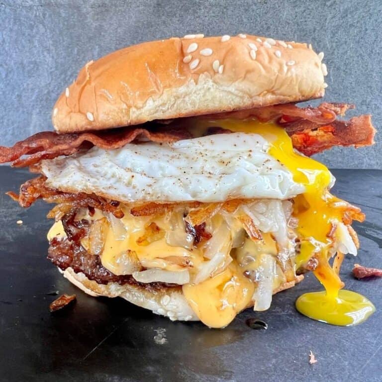 breakfast burger with egg, bacon, cheese, hash browns, and burger patty