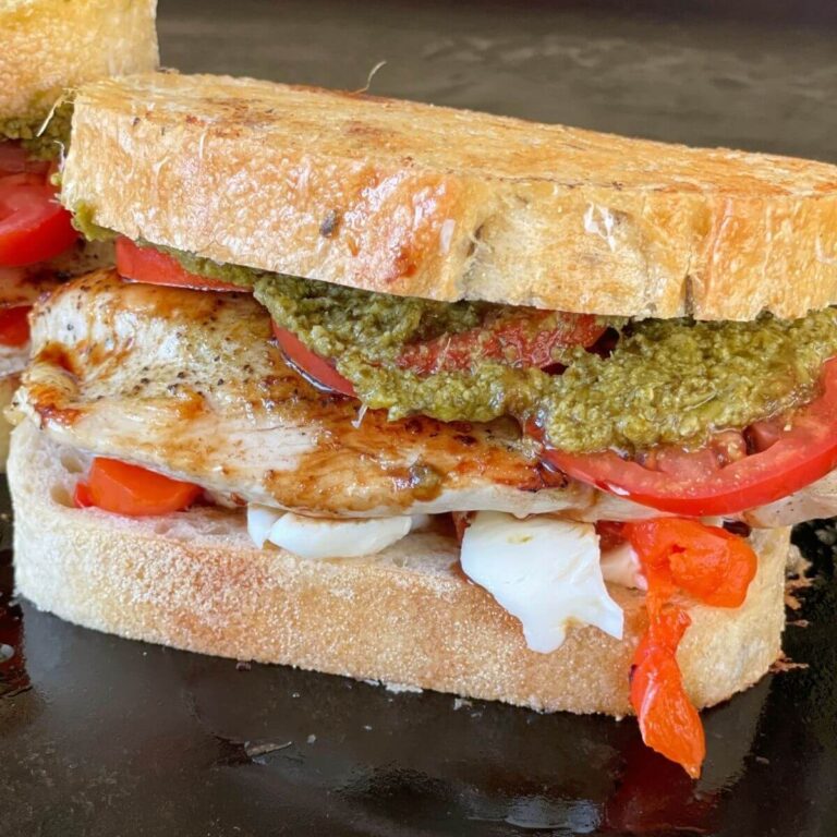 chicken caprese sandwich on a flat top grill