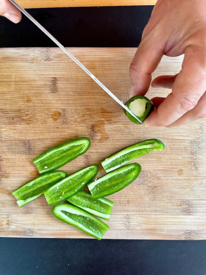 cutting jalapeno poppers into strips