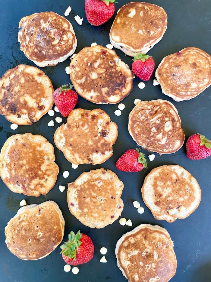 strawberry shortcake pancakes on a cutting board