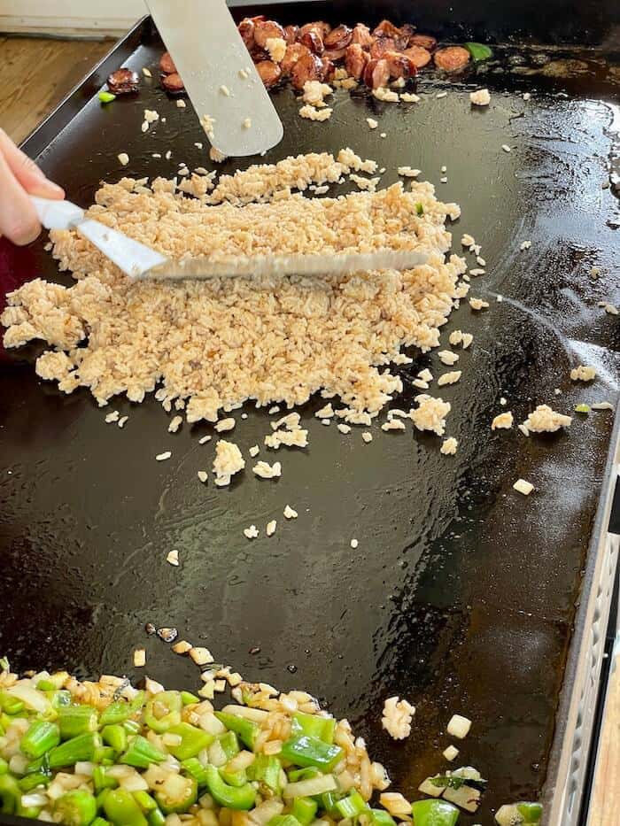 cooking fried rice on a griddle