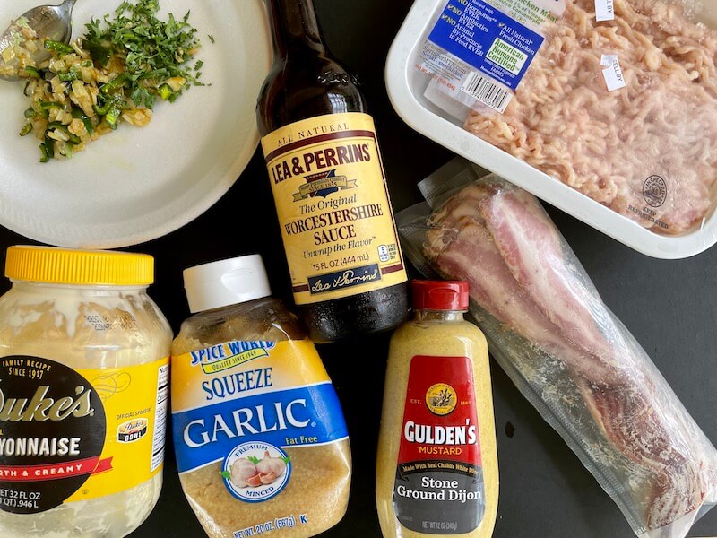 ingredients for chicken smash burgers on a cutting board