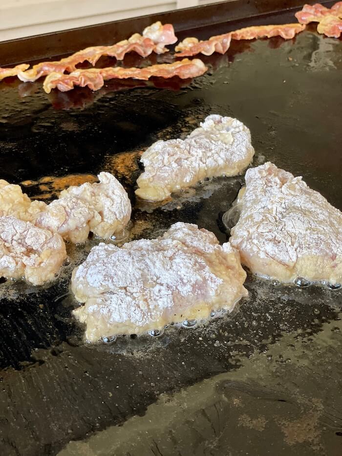 shallow frying chicken on a blackstone griddle