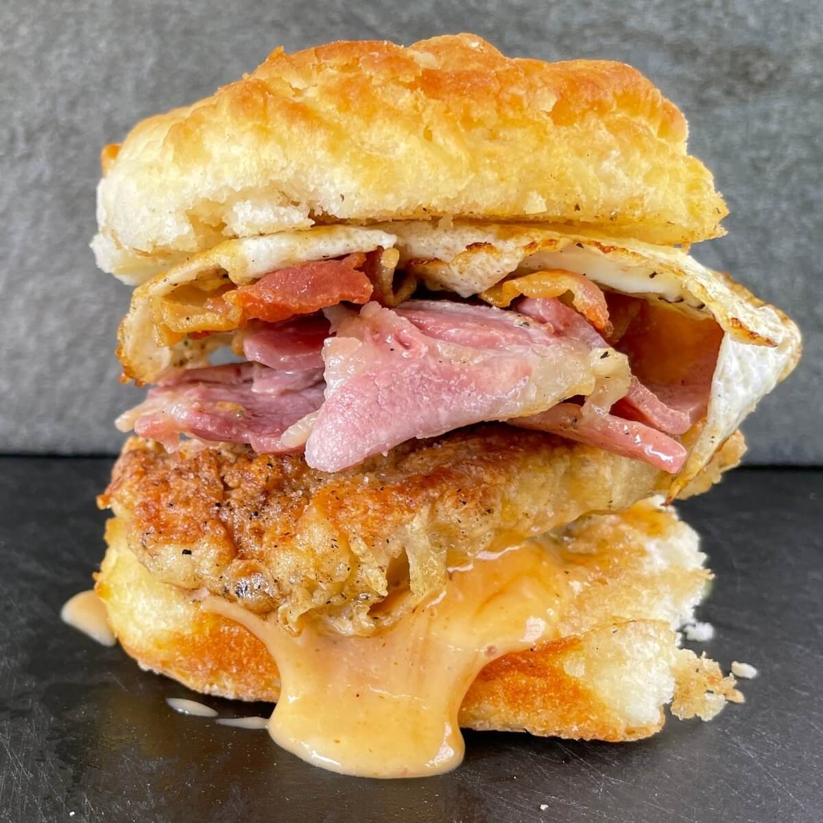 https://theflattopking.com/wp-content/uploads/2022/07/fried-chicken-breakfast-sandwich.jpg