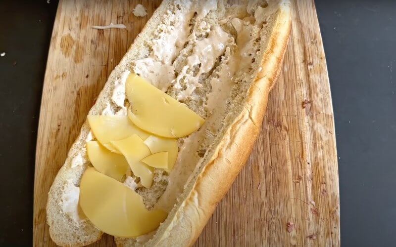 twin french bread hollowed out with horseradish mayo and cheese