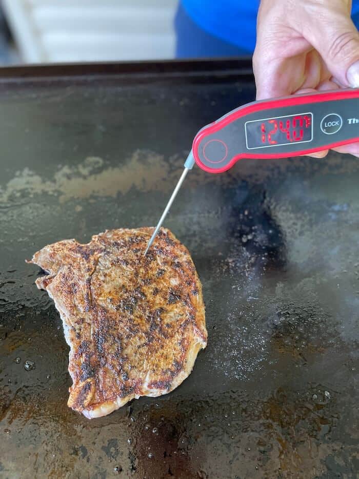 steak cooking on a griddle