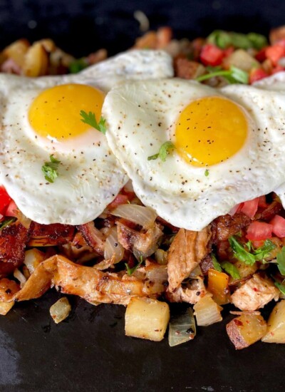breakfast hash with peppers, onions, potatoes, brisket, and eggs