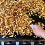 Chex mix cooking on a Blackstone griddle