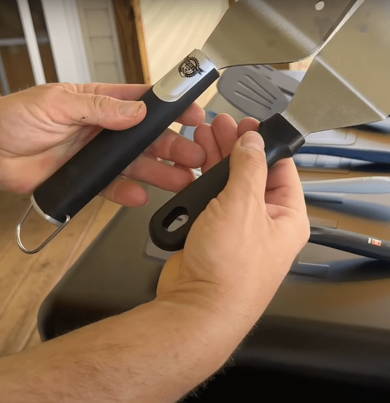 two griddle spatulas with different handle lengths