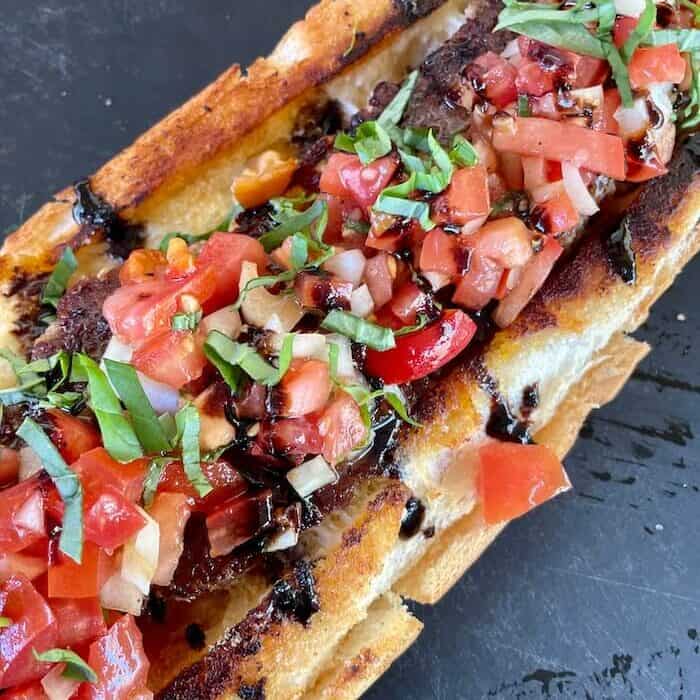 Stuffed Italian Sausage Bread with Quick Bruschetta Topping