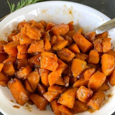 candied sweet potatoes in a serving bowl