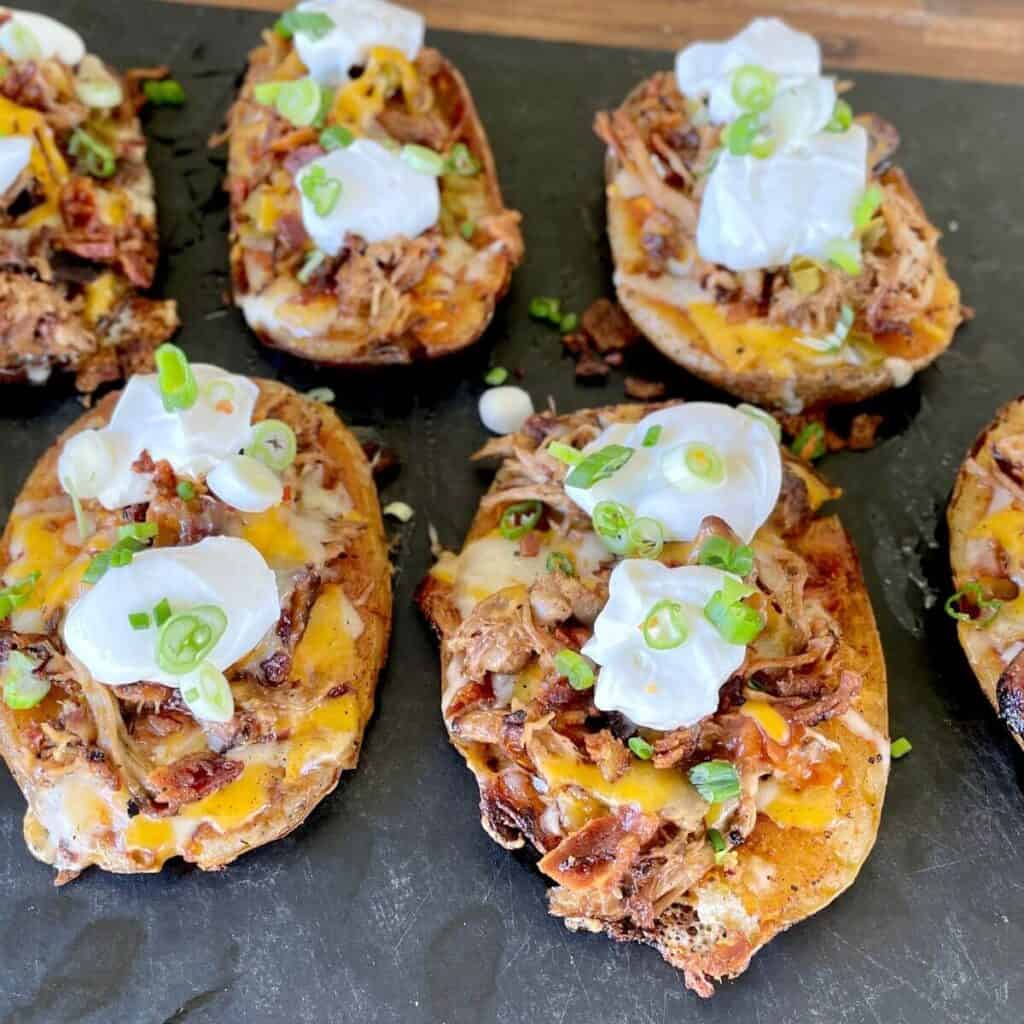 smashed potato skins with barbecue pork made on blackstone griddle