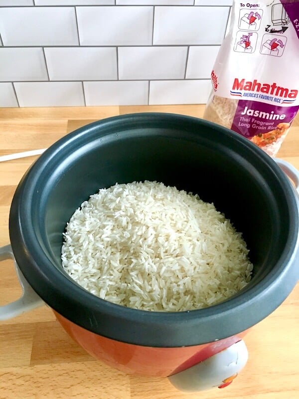 white rice cooking in a rice cooker