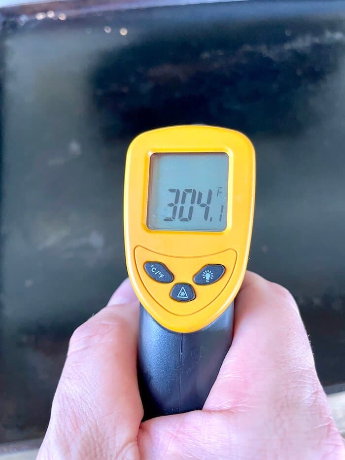 infrared thermometer showing 304 degrees for a blackstone griddle