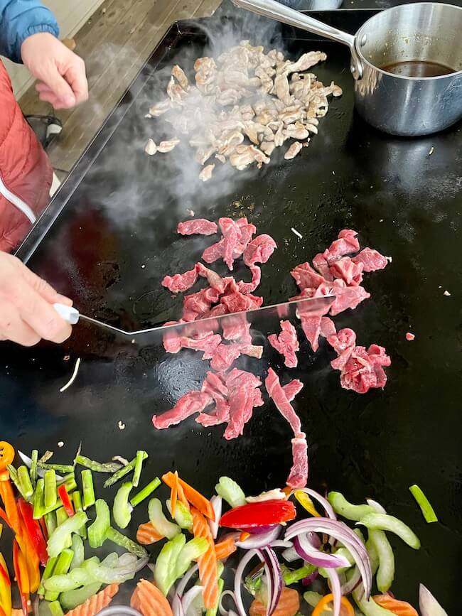 cooking lo mein on a Blackstone griddle