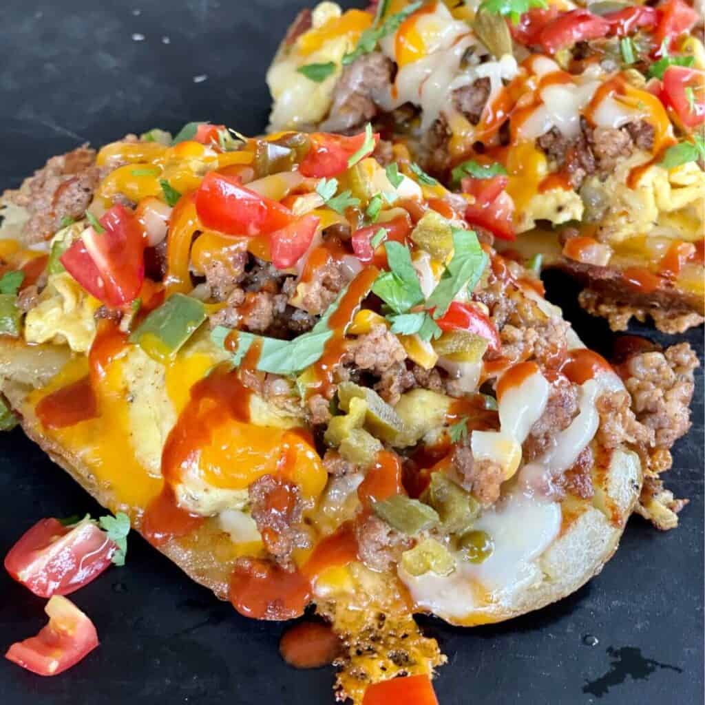 breakfast potato skins with sausage, eggs, and cheese