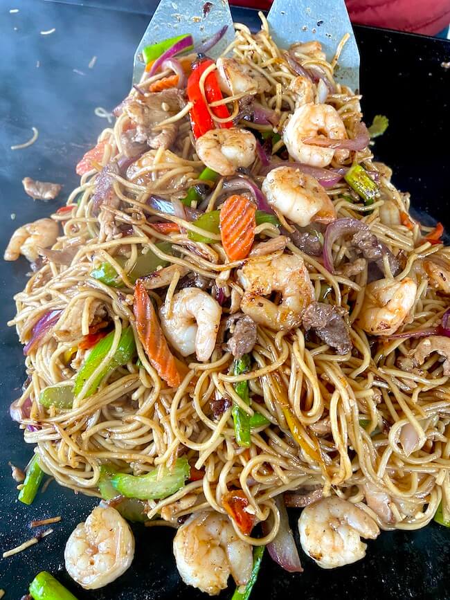 shrimp, chicken, and beef lo mein on a Blackstone griddle