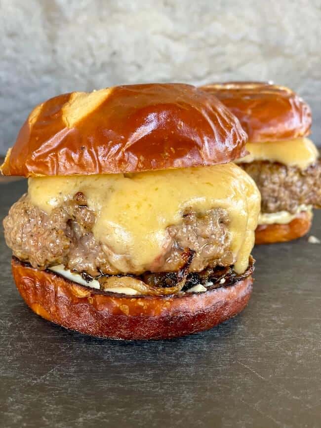 pub burger with beer cheese on a pretzel bun