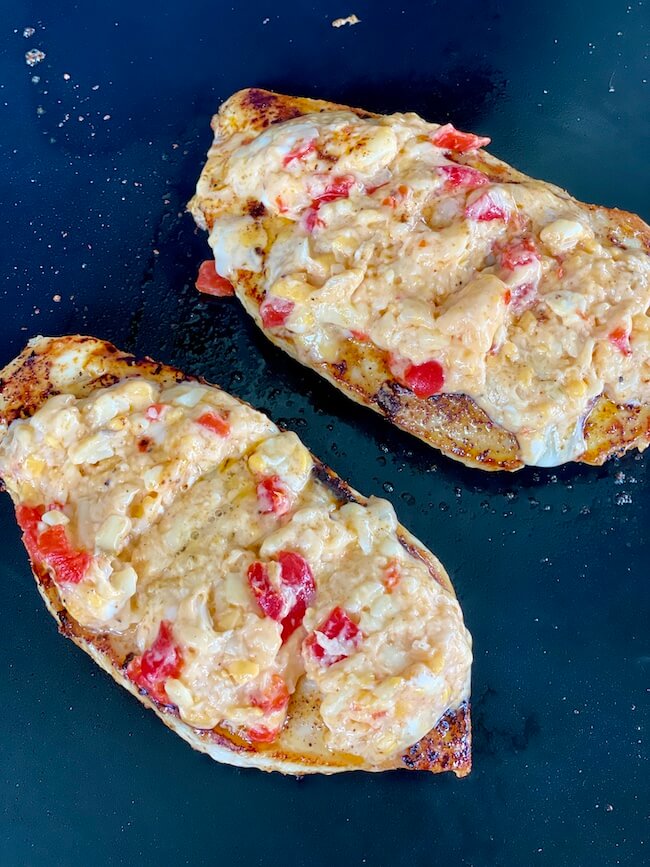chicken breasts on the griddle with pimento cheese