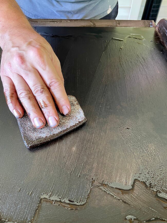cleaning a griddle with a grill brick