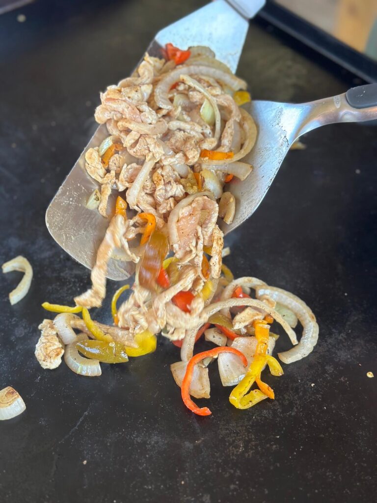 sautéing chicken and vegetables together