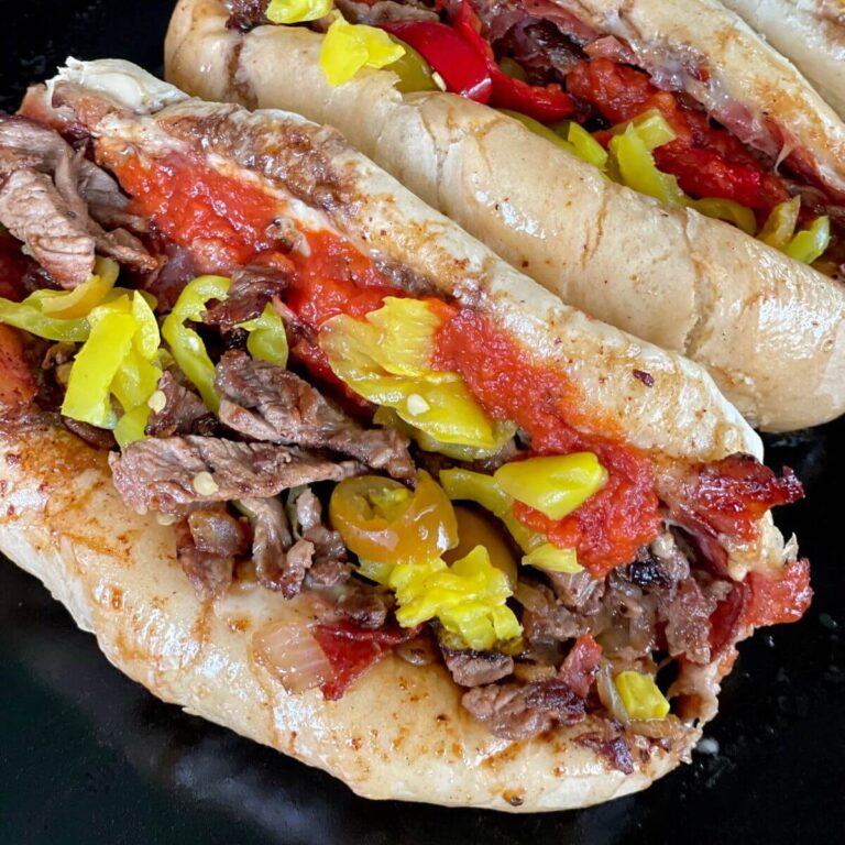 Italian cheese steak sandwich with marinara and banana peppers