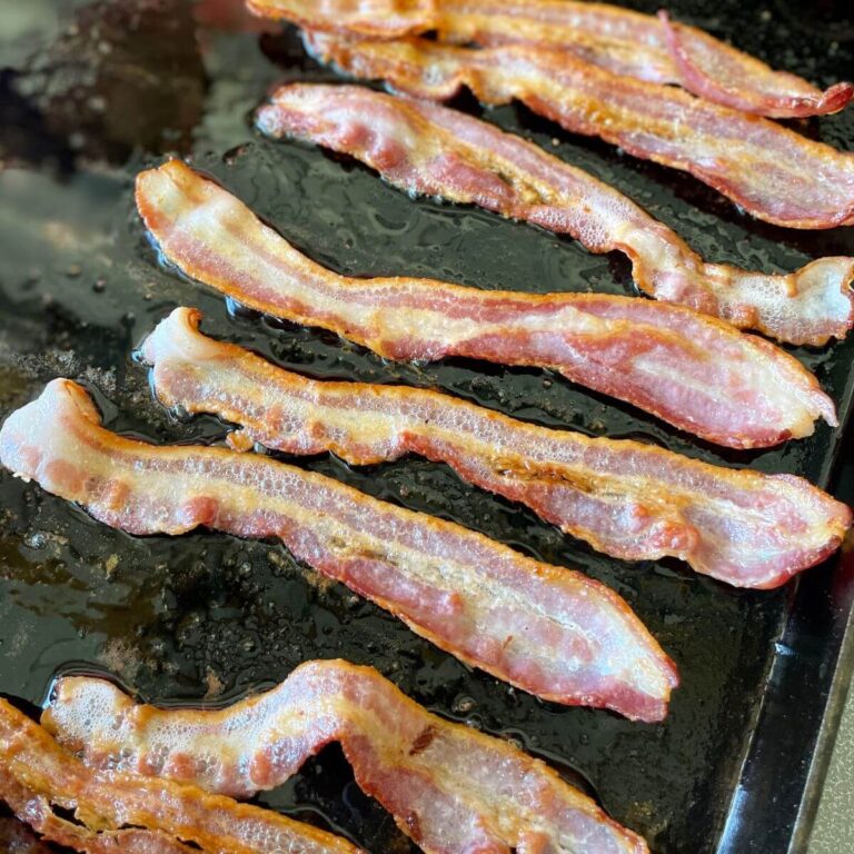 cooking bacon on the griddle