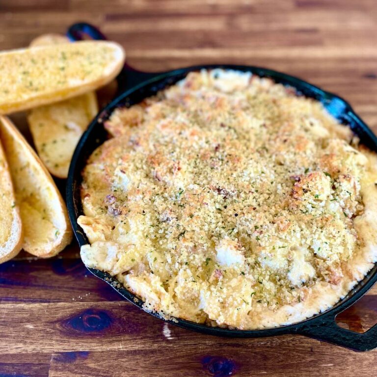 blackened chicken Alfredo with tortellini in a cast iron skillet