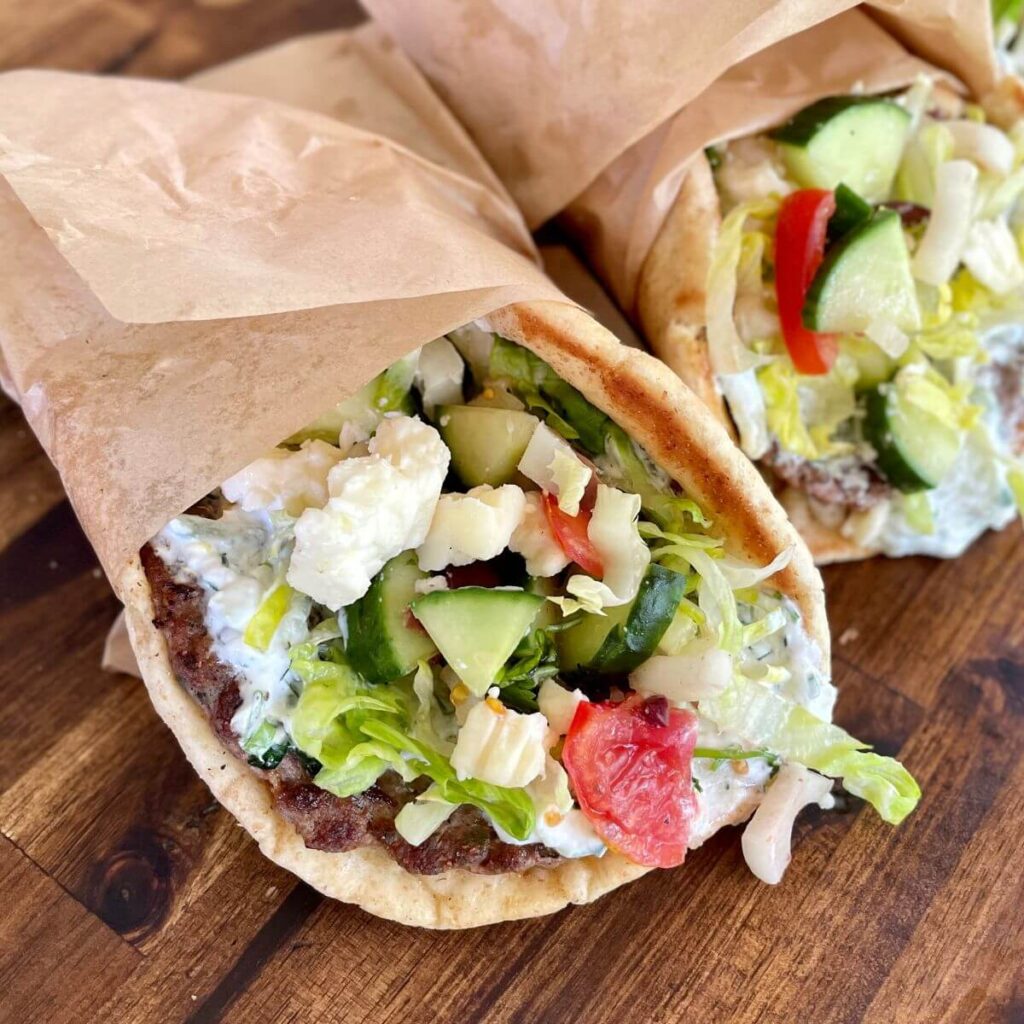 Greek smashed gyro tacos wrapped in deli paper