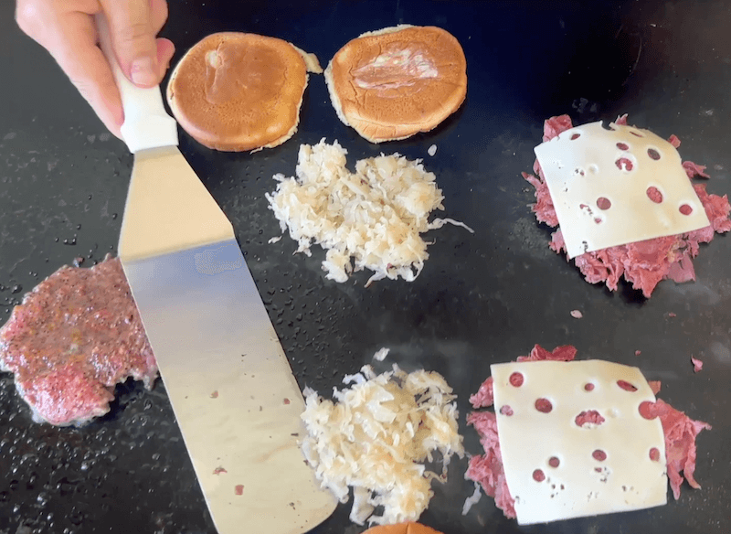 making reuben burgers on the blackstone griddle