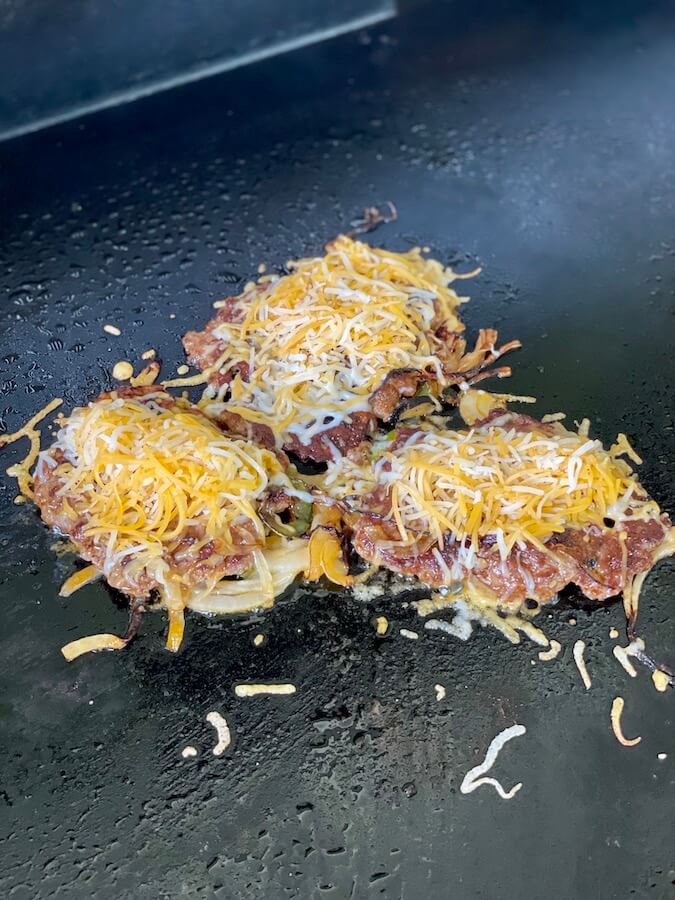 melted cheese on burger patties