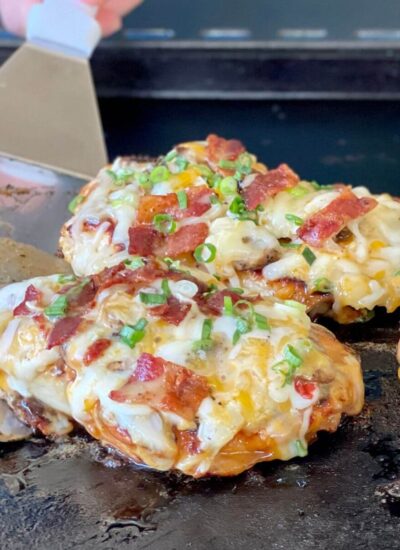 loaded grilled chicken on the blackstone griddle with cheese, bacon, and mushrooms