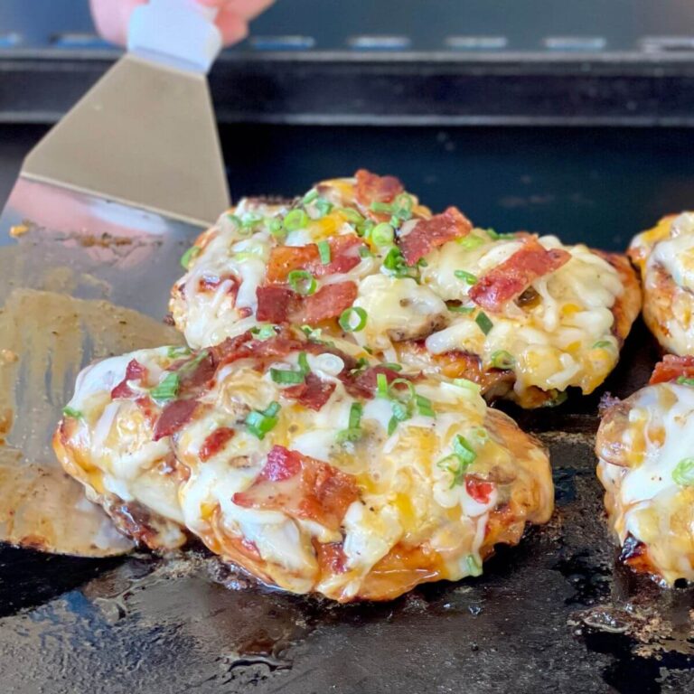 loaded grilled chicken on the blackstone griddle with cheese, bacon, and mushrooms