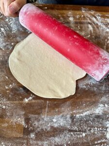 rolling out dough with a rolling pin
