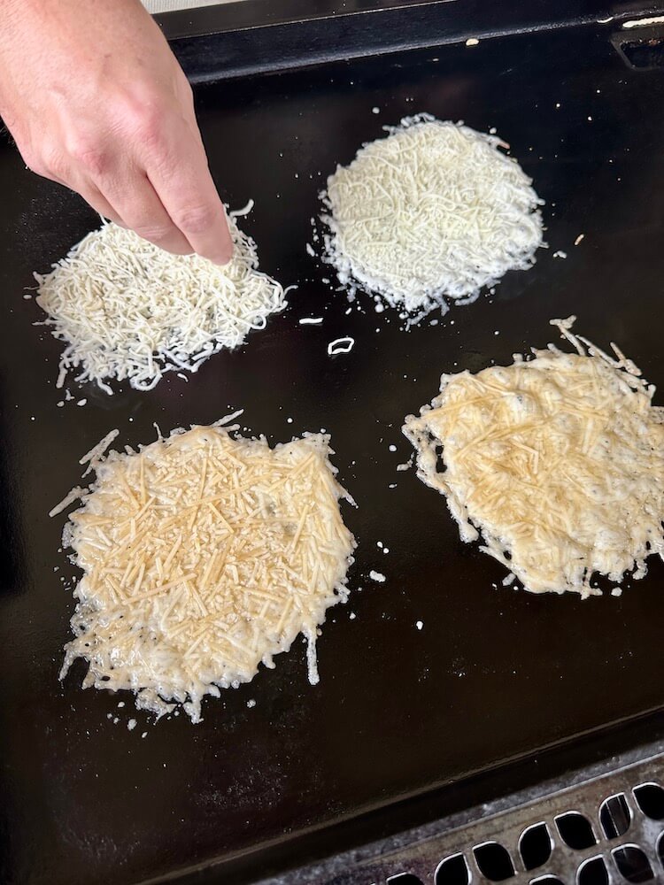 making parmesan cheese crisps on the griddle