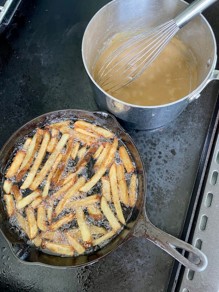 deep frying french fries on a griddle