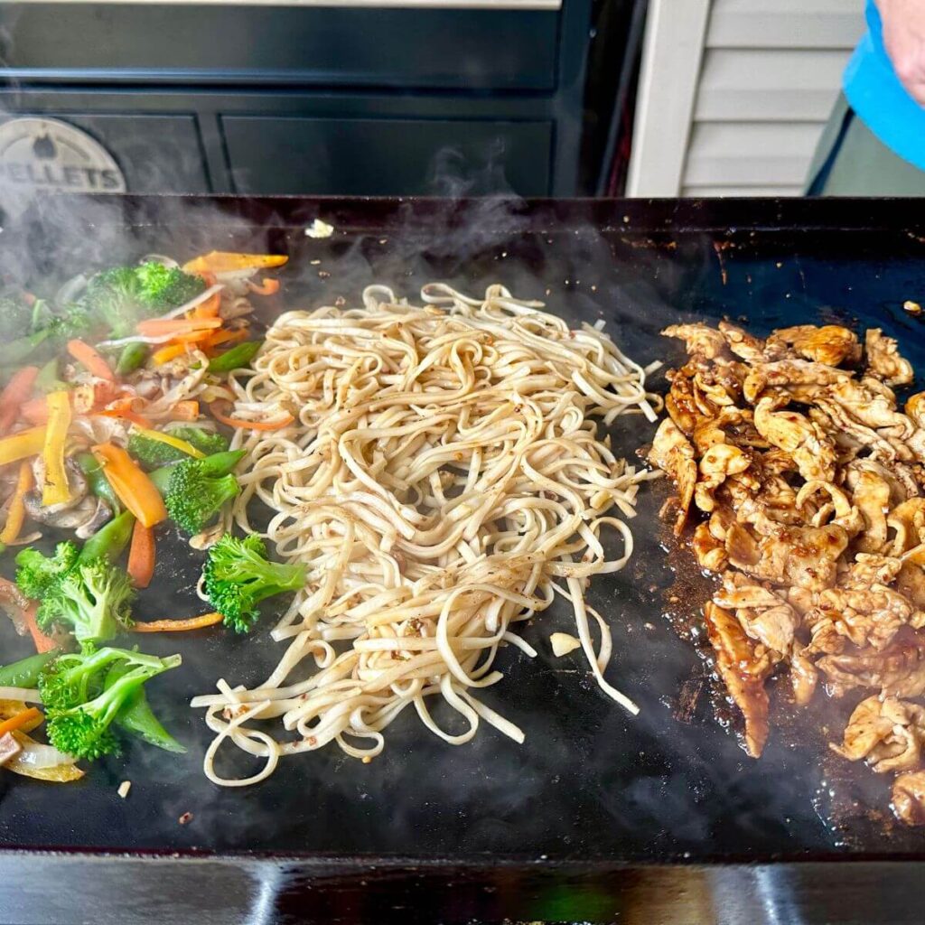 cooking teriyaki chicken stir fry on the Blackstone griddle