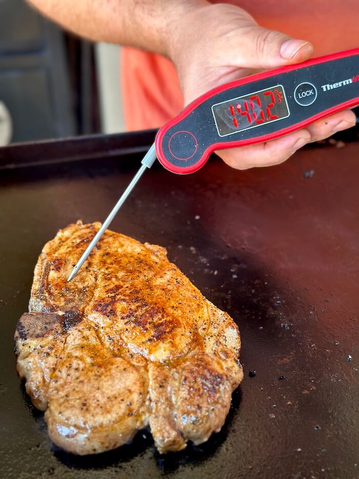 using instant read thermometer to check temperature of pork chop