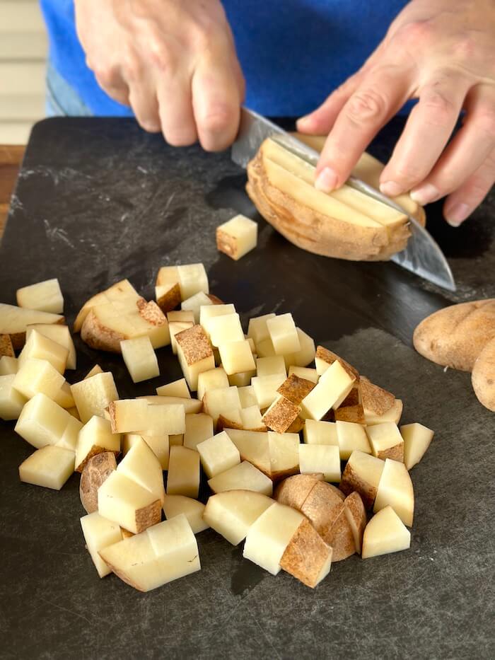 cutting potato into cubes