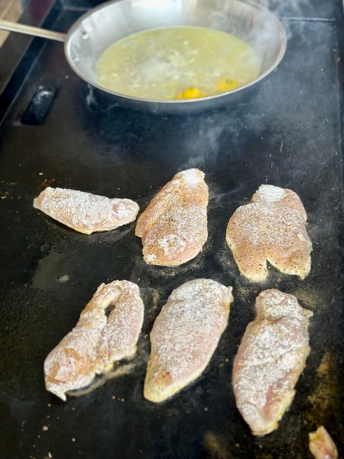 cooking lemon chicken on a griddle